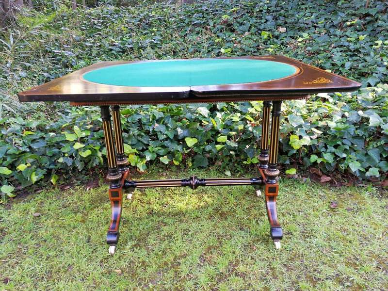 A Napoleon III Inlaid Ebony, Walnut and Ormolu Card / Stretcher Table