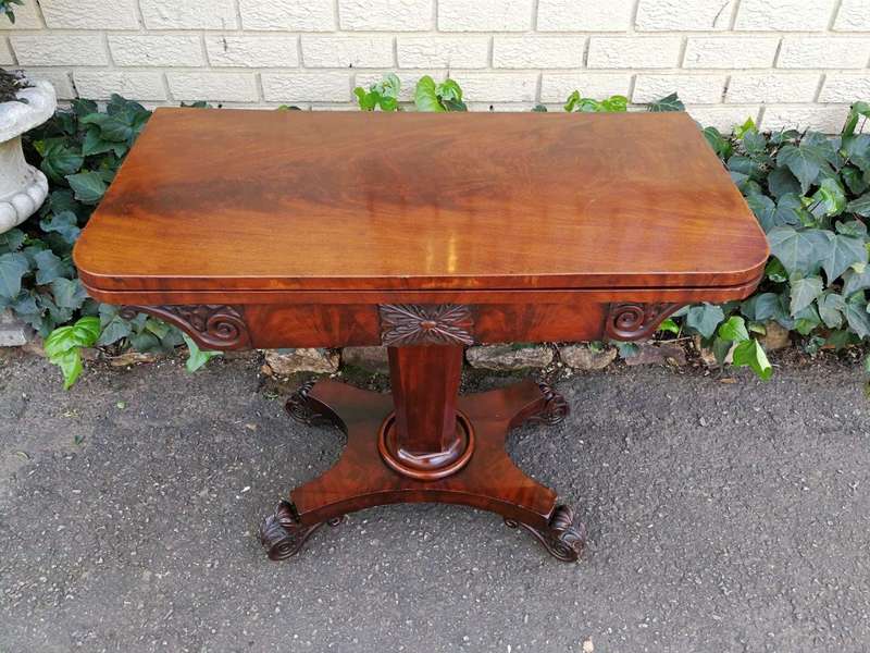 A Victorian Mahogany Folding Card Table on Castors