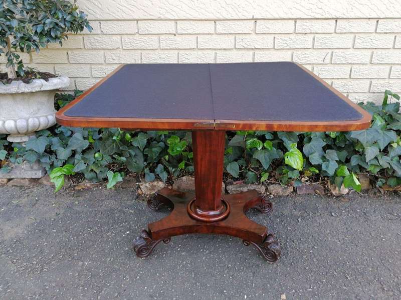 A Victorian Mahogany Folding Card Table on Castors