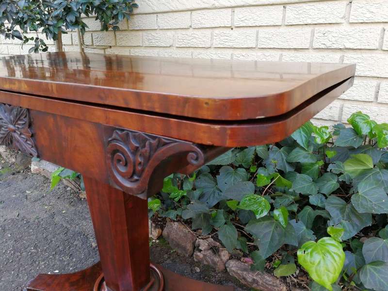 A Victorian Mahogany Folding Card Table on Castors