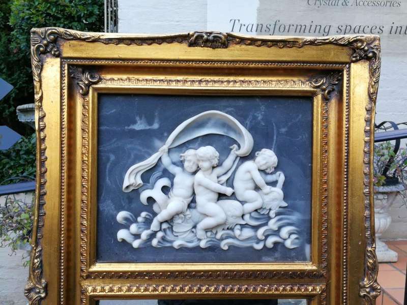 A Circa 1900 French Louis XVI Style Wooden Gilt-painted and Bevelled Mirror with a Carved Black a...