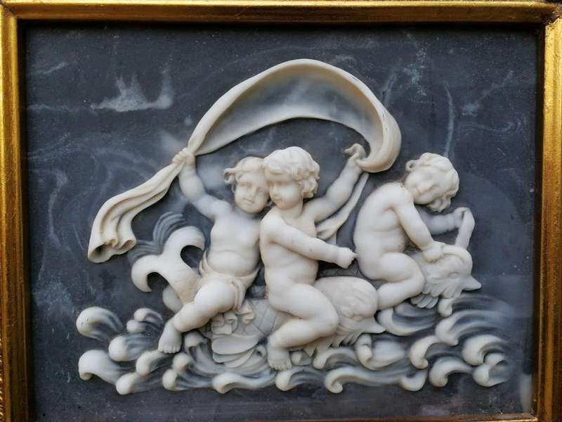 A Circa 1900 French Louis XVI Style Wooden Gilt-painted and Bevelled Mirror with a Carved Black a...