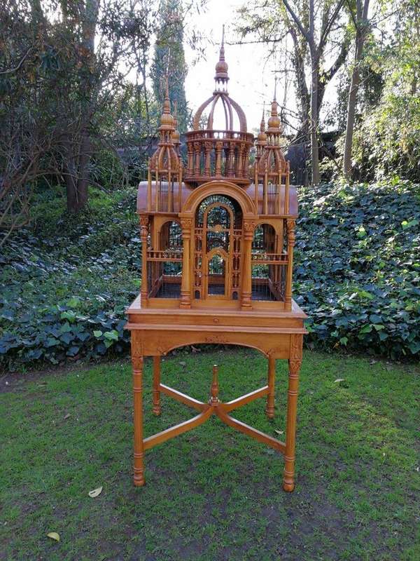 A 20th Century Carved Mahogany and Teak Wood Architectural Cathedral Style Birdcage on Stand