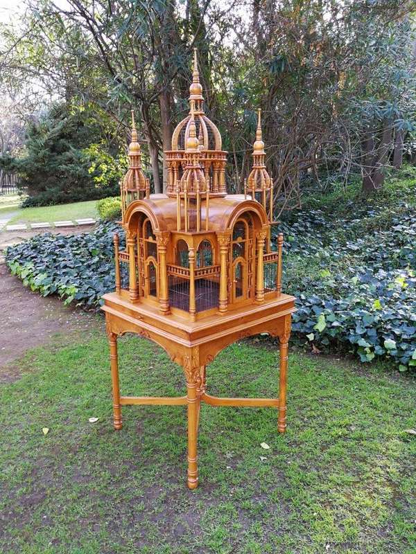 A 20th Century Carved Mahogany and Teak Wood Architectural Cathedral Style Birdcage on Stand