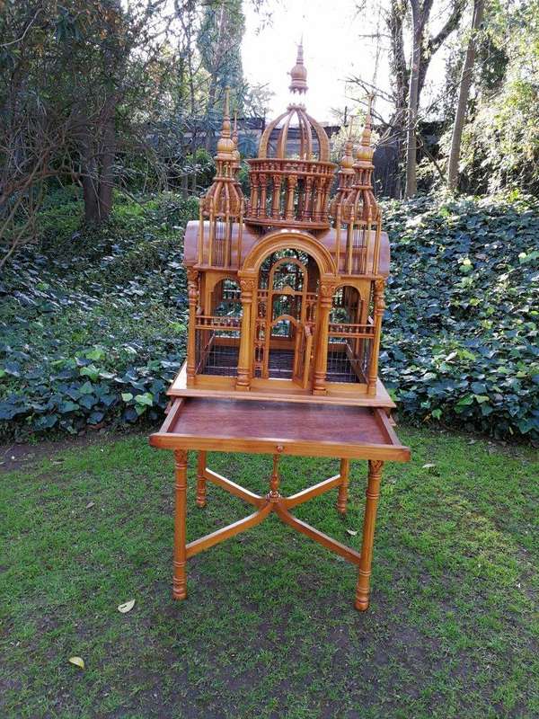 A 20th Century Carved Mahogany and Teak Wood Architectural Cathedral Style Birdcage on Stand