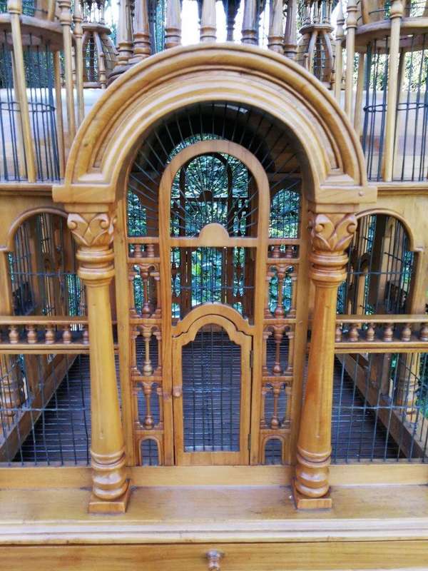 A 20th Century Carved Mahogany and Teak Wood Architectural Cathedral Style Birdcage on Stand