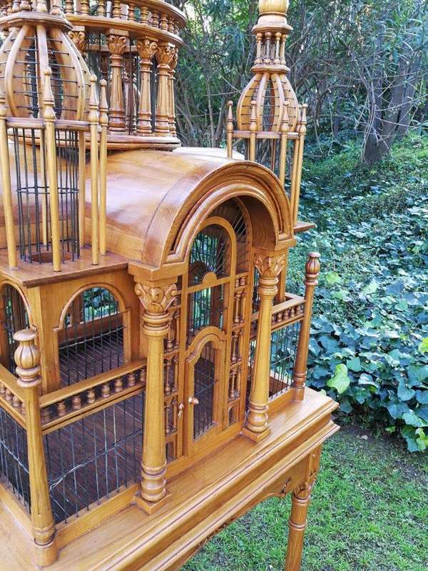 A 20th Century Carved Mahogany and Teak Wood Architectural Cathedral Style Birdcage on Stand