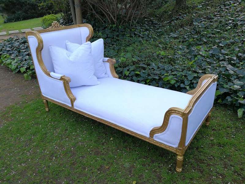 A Rare Carved and Gilded Daybed/Chaise in white upholstered