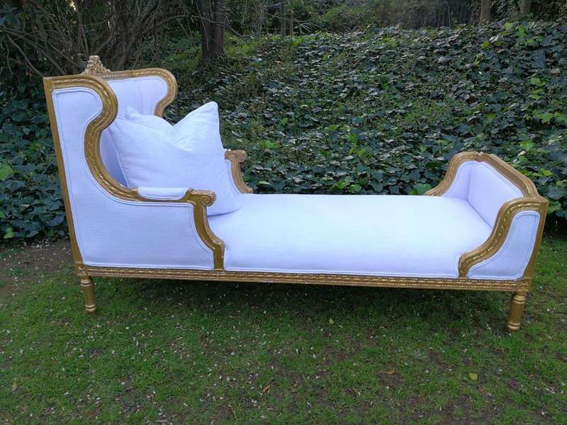 A Rare Carved and Gilded Daybed/Chaise in white upholstered