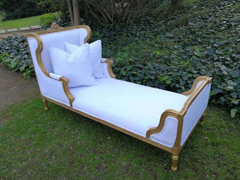 A Rare Carved and Gilded Daybed/Chaise in white upholstered