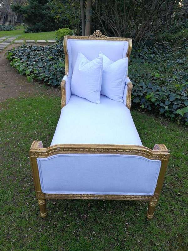 A Rare Carved and Gilded Daybed/Chaise in white upholstered