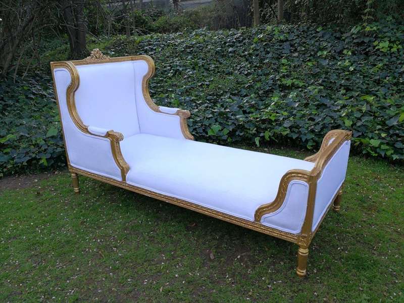 A Rare Carved and Gilded Daybed/Chaise in white upholstered