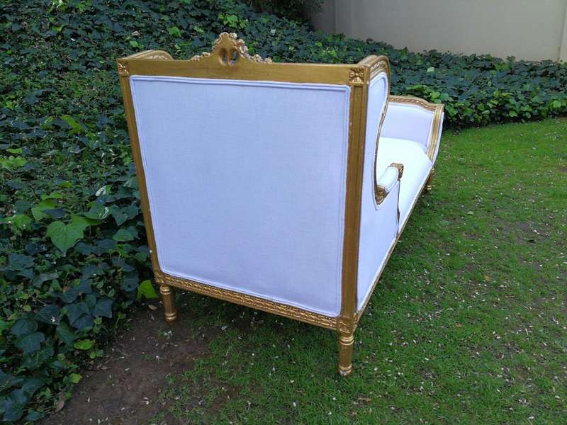 A Rare Carved and Gilded Daybed/Chaise in white upholstered