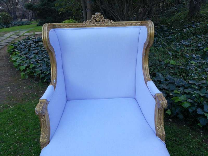 A Rare Carved and Gilded Daybed/Chaise in white upholstered
