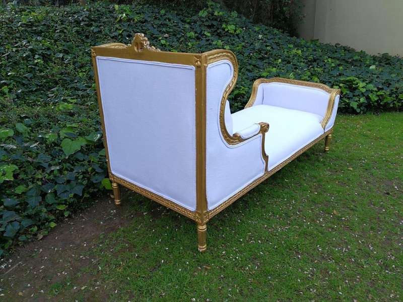 A Rare Carved and Gilded Daybed/Chaise in white upholstered