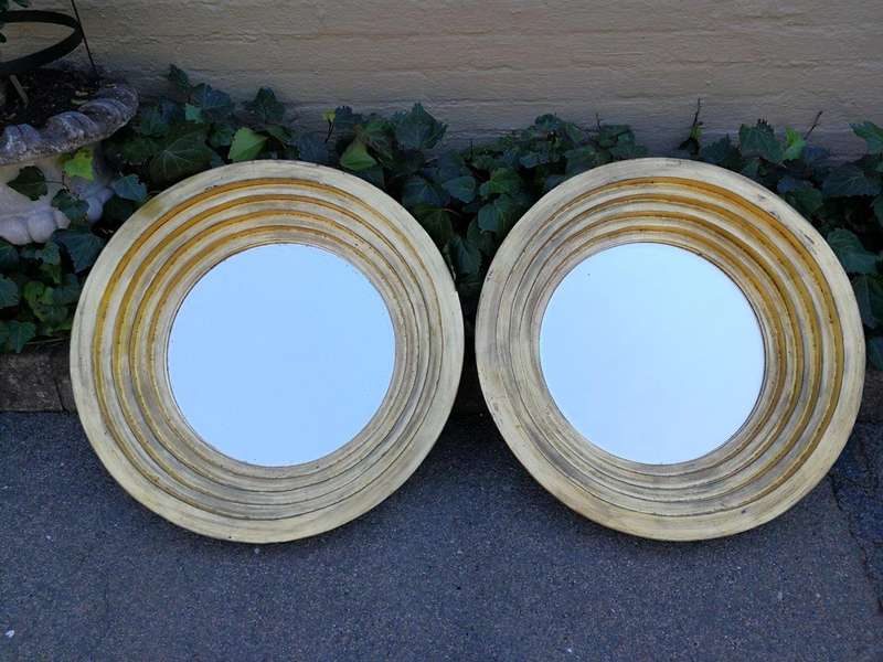 A Pair Of Circular Bevelled Wooden Mirrors with a Hand-gilded Gold Leaf Detail