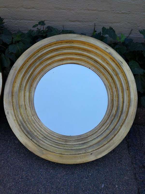 A Pair Of Circular Bevelled Wooden Mirrors with a Hand-gilded Gold Leaf Detail