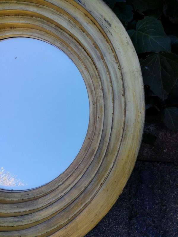 A Pair Of Circular Bevelled Wooden Mirrors with a Hand-gilded Gold Leaf Detail