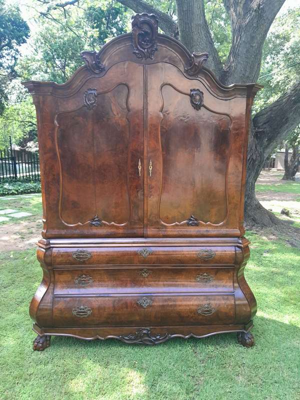 An 18th Century Dutch Ornately Carved Walnut Bombe Cabinet / Armoire With Original Handles and Locks