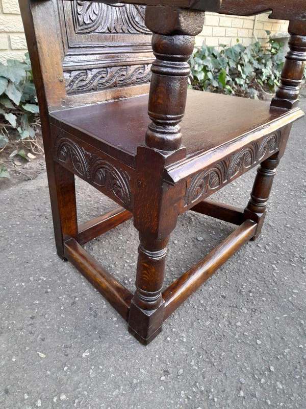 An 18th / 19th Century Carved Oak Wainscot Armchair the date and initials H. HO