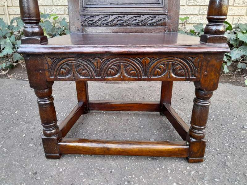 An 18th / 19th Century Carved Oak Wainscot Armchair the date and initials H. HO