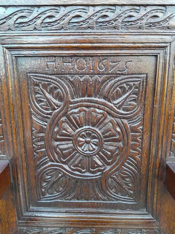An 18th / 19th Century Carved Oak Wainscot Armchair the date and initials H. HO