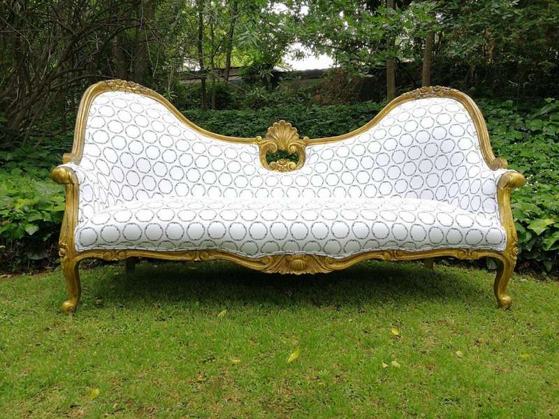 A 20th century, Victorian-style Gilt-painted Carved settee