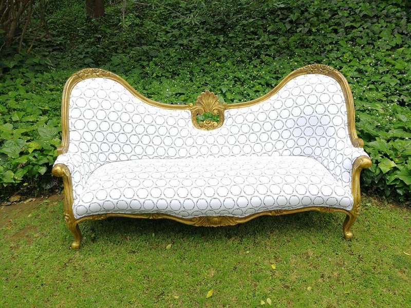 A 20th century, Victorian-style Gilt-painted Carved settee