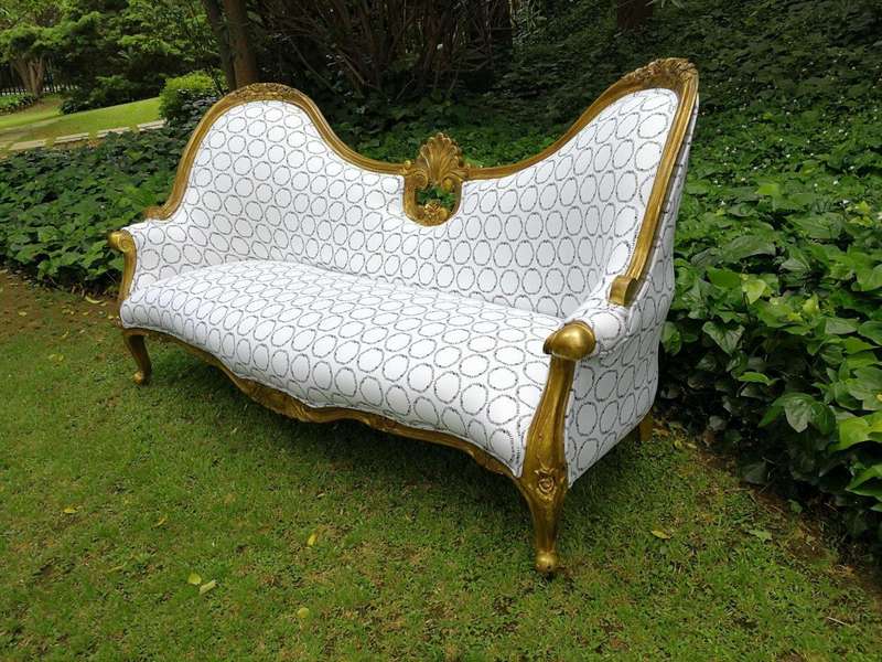 A 20th century, Victorian-style Gilt-painted Carved settee