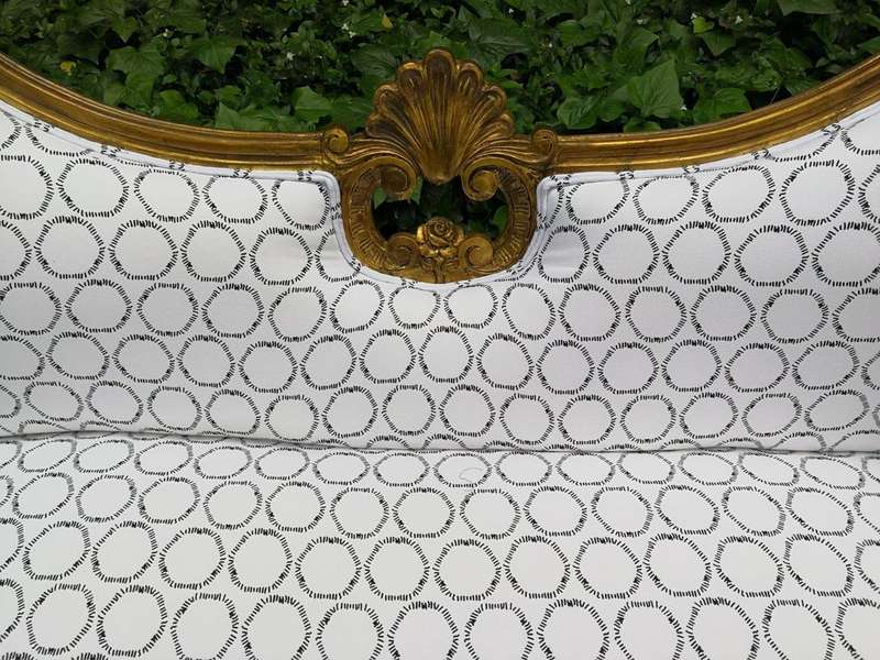 A 20th century, Victorian-style Gilt-painted Carved settee