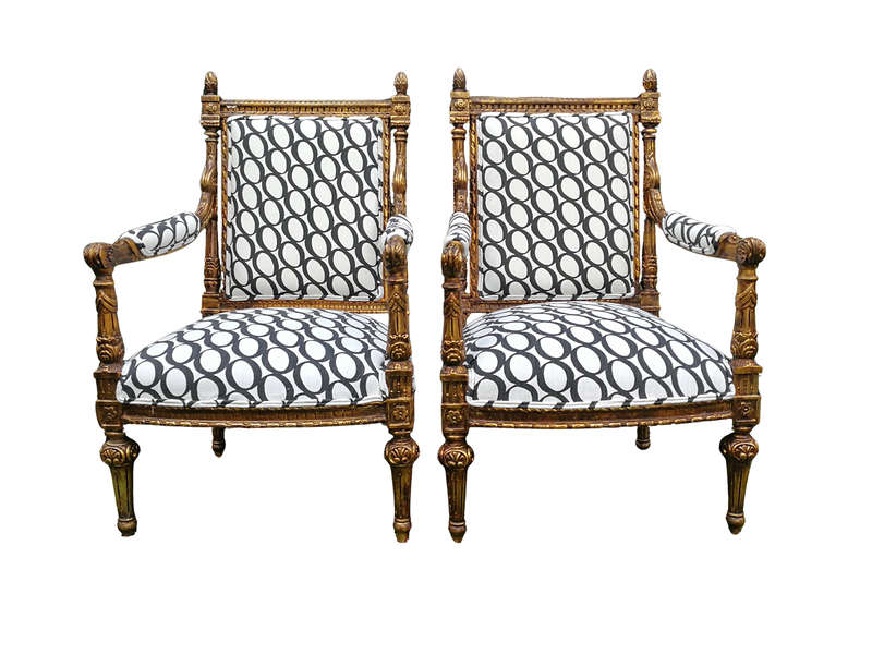 A Pair of French Style Ornately Carved and Gilded Armchairs ND