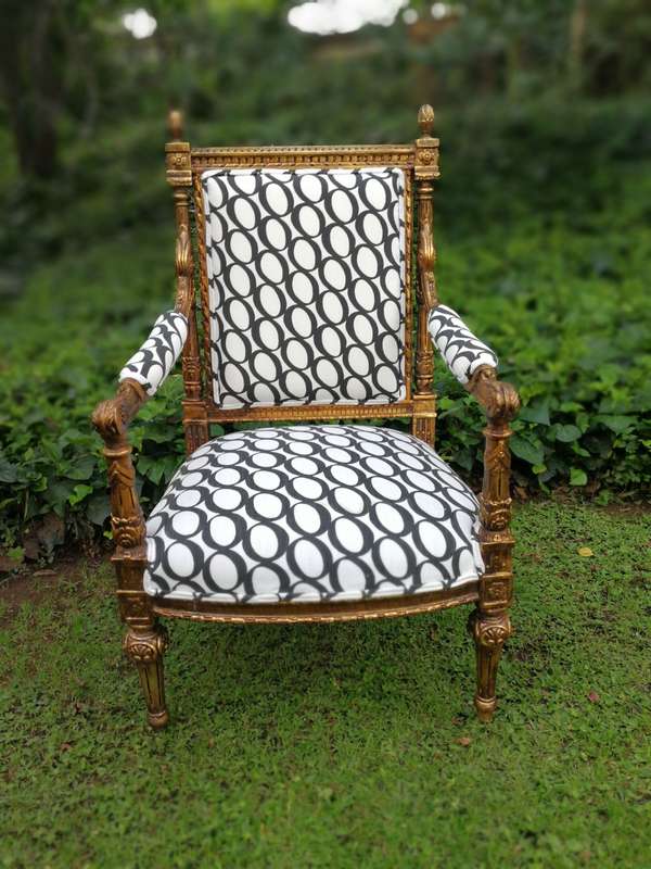 A Pair of French Style Ornately Carved and Gilded Armchairs ND