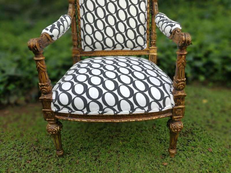 A Pair of French Style Ornately Carved and Gilded Armchairs ND