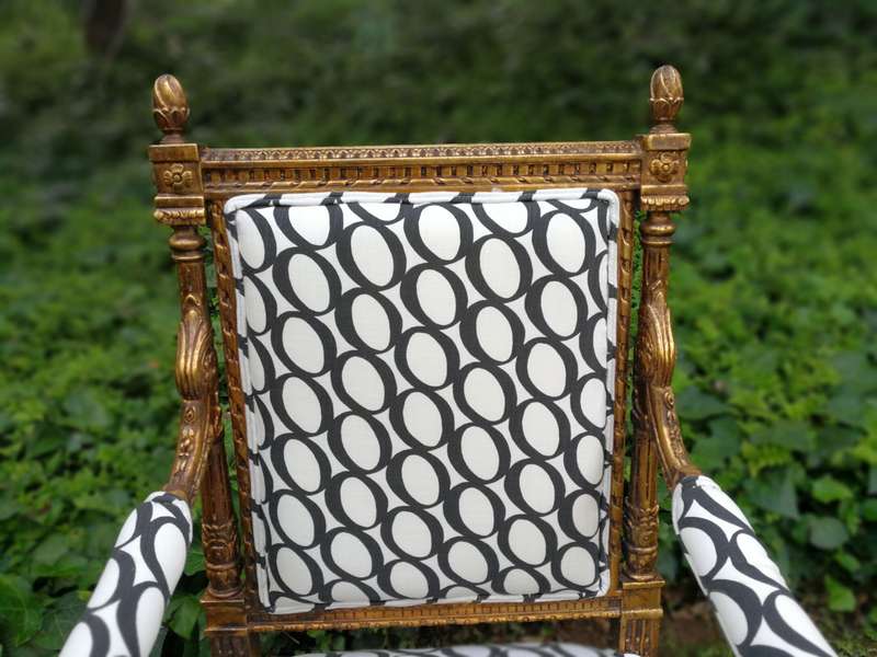 A Pair of French Style Ornately Carved and Gilded Armchairs ND