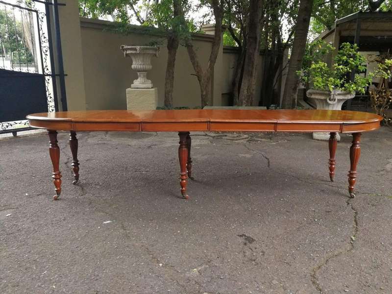 A 19th Century Victorian Style Teak Extending Dining Table