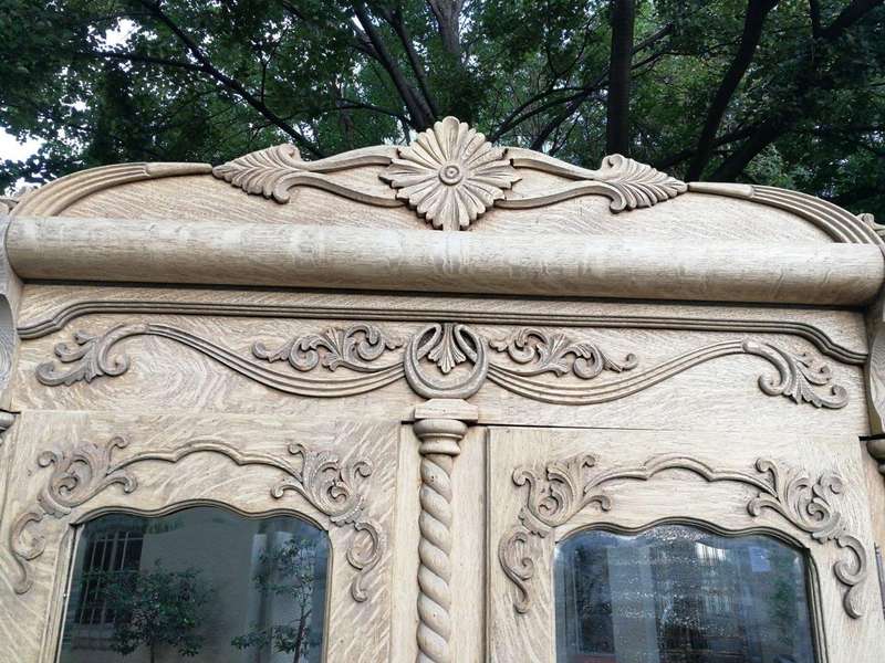 An Antique Victorian English Carved And Bleached Oak Armoire With Bevelled Mirror Doors And Two D...