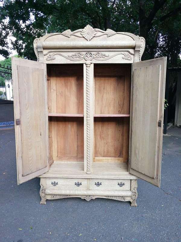 An Antique Victorian English Carved And Bleached Oak Armoire With Bevelled Mirror Doors And Two D...