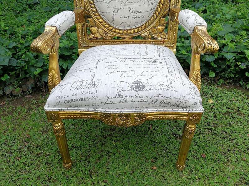 A 20TH Century Pair Of Ornately Carved And Hand Gilded French Style Armchairs Upholstered in a Cu...