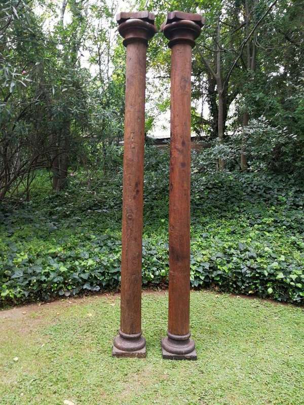An Antique Pair Of Teak Pillars With Stone Bases