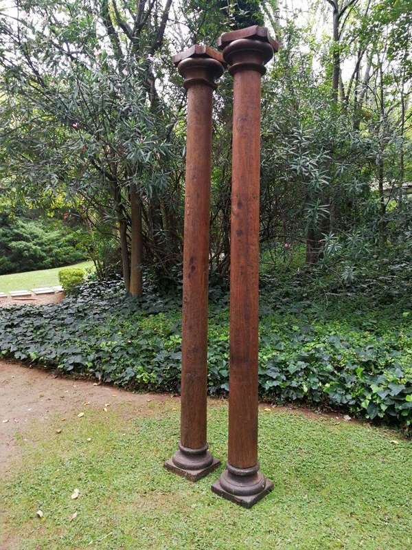 An Antique Pair Of Teak Pillars With Stone Bases