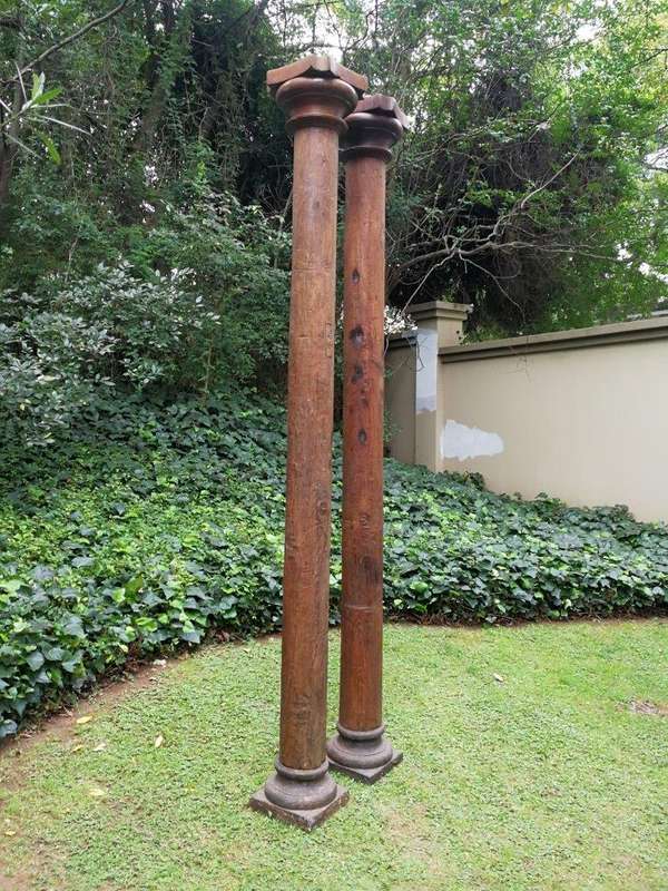 An Antique Pair Of Teak Pillars With Stone Bases