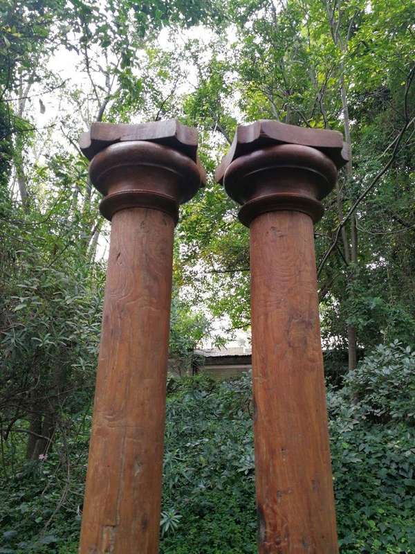An Antique Pair Of Teak Pillars With Stone Bases