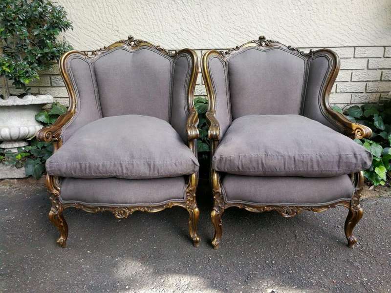 A 20th Century Pair Of French Style Hand Gilded Bergere/Wing-Back Armchairs Upholstered In An Imp...
