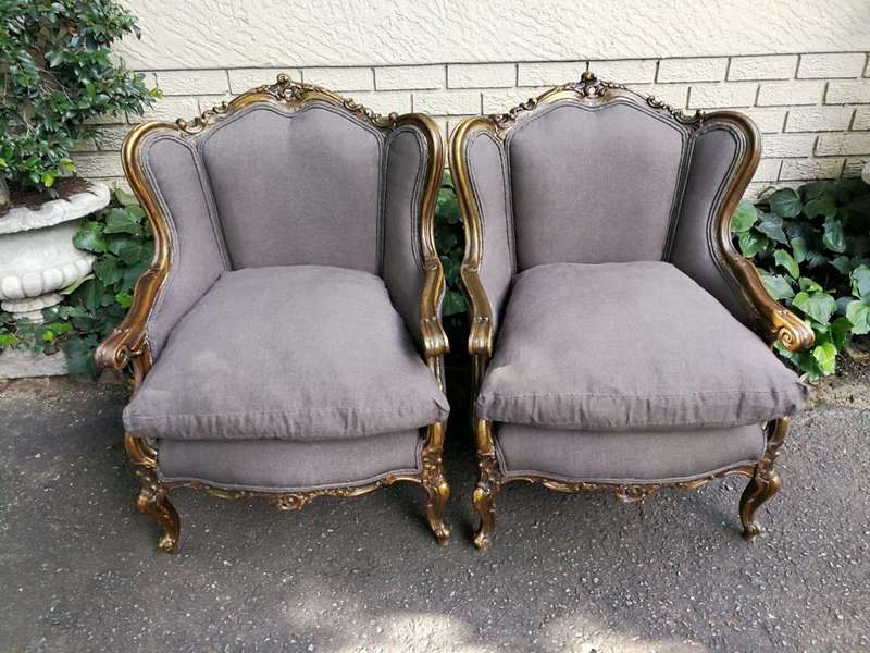 A 20th Century Pair Of French Style Hand Gilded Bergere/Wing-Back Armchairs Upholstered In An Imp...