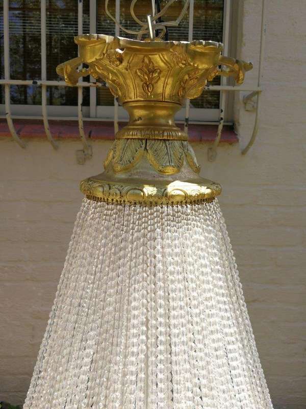 A Large Antique Gold Beaded Empire Style Chandelier