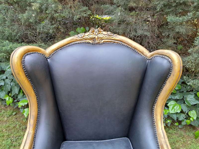 A Pair of French Style Hand Gilded Armchairs Upholstered in Leather
