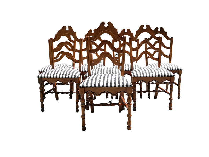 A Set Of Eight Carved Dining Chairs