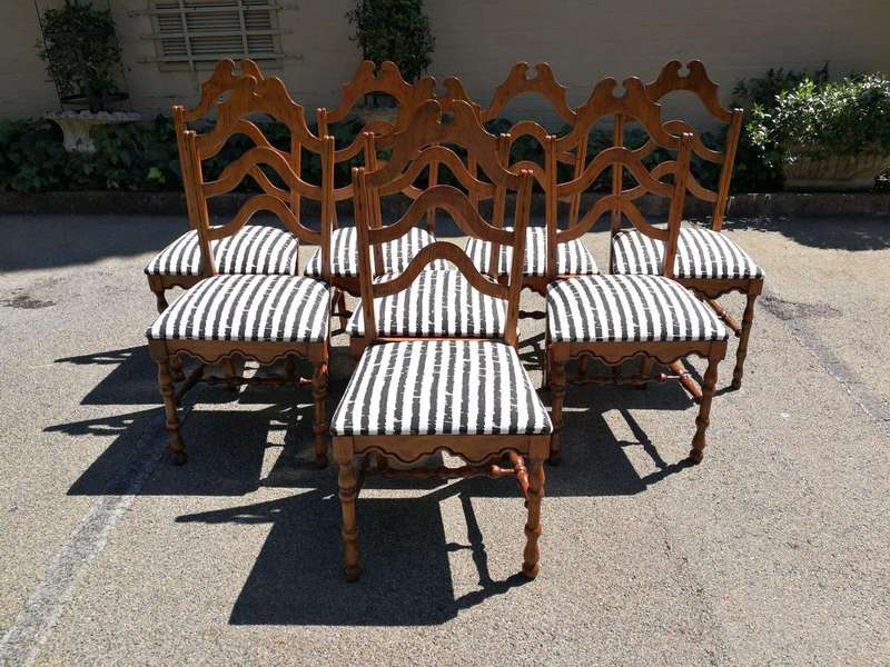 A Set Of Eight Carved Dining Chairs