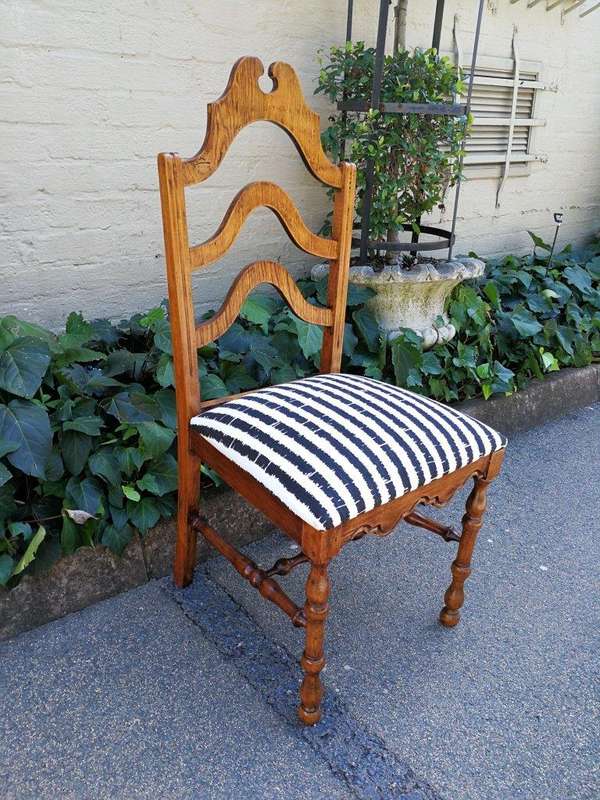A Set Of Eight Carved Dining Chairs