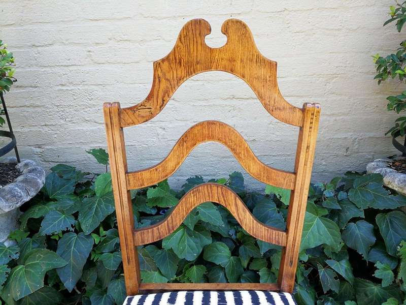 A Set Of Eight Carved Dining Chairs